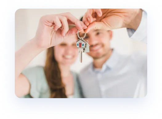 Wife and husband holding their new house key